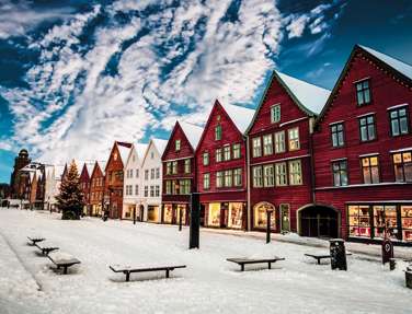 Famous Bryggen Street With Wooden Colored Houses In Bergen At Christmas, Norway
